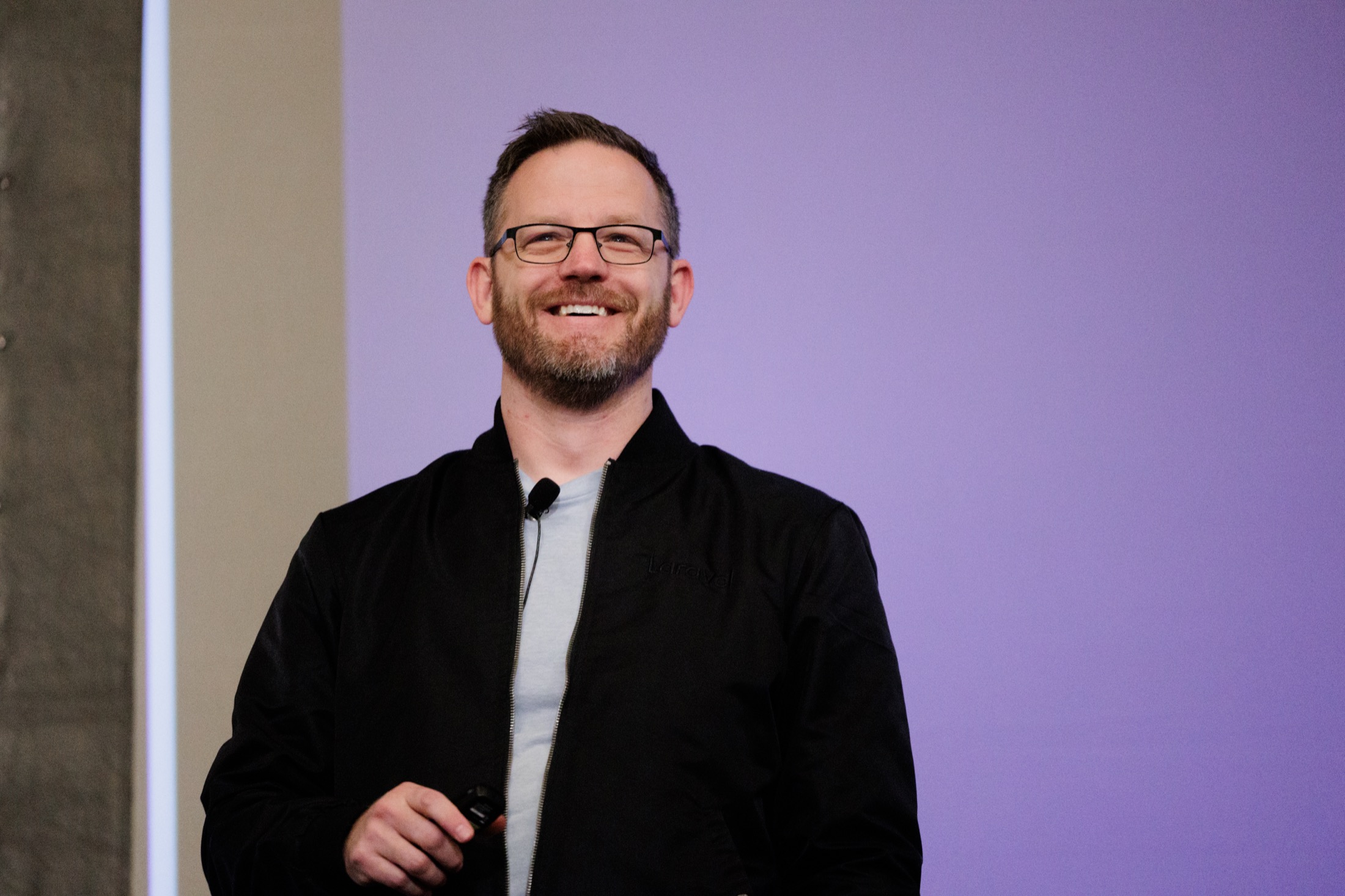 Kevin McKee smiling on stage at WireLive