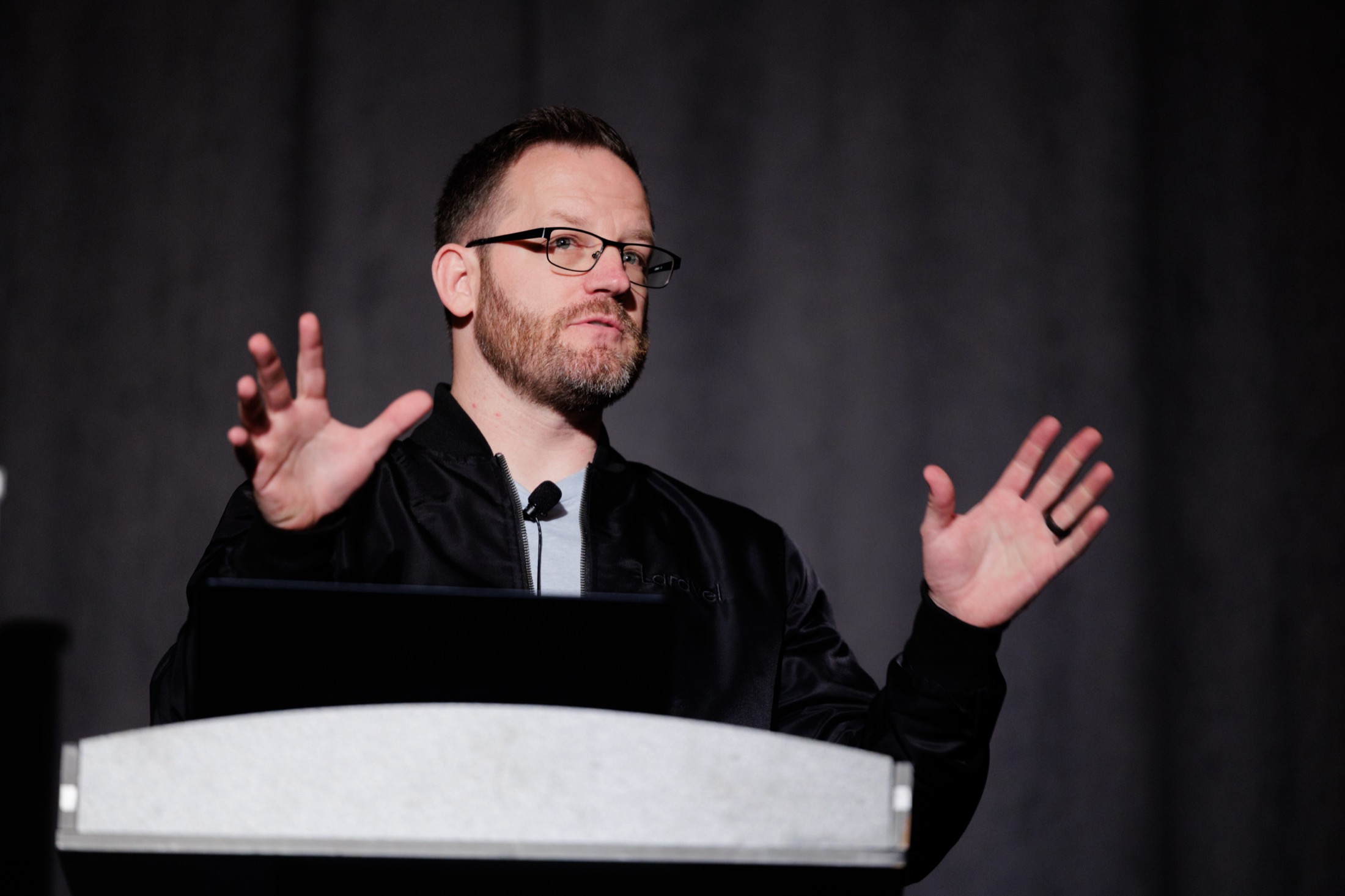 Kevin McKee speaking behind a podium at WireLive